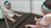 Cute Baby Playing With The Mirror
