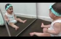 Cute Baby Playing With The Mirror