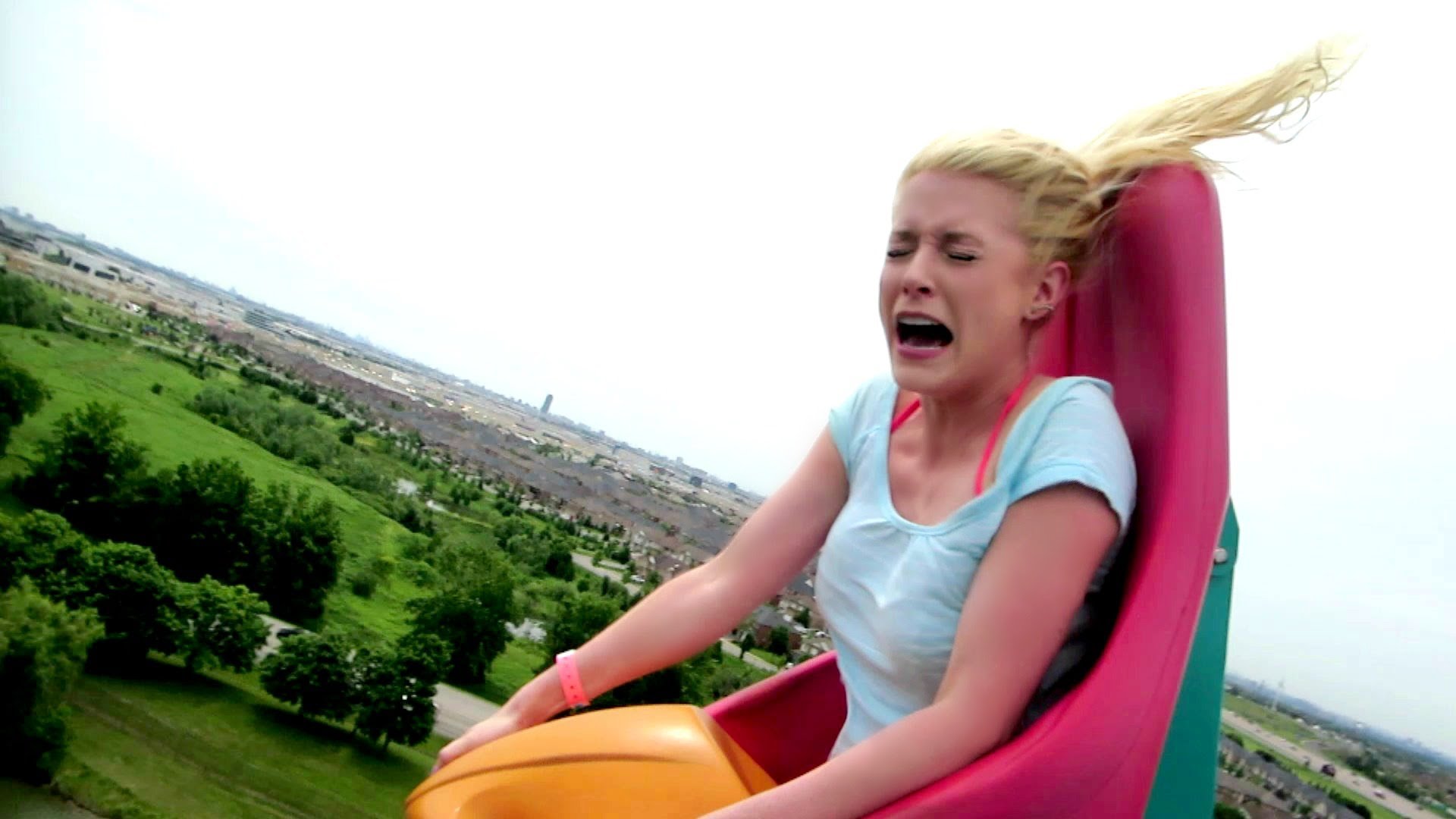 Blue-haired petite teen riding a roller coaster - wide 11