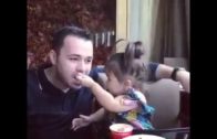 Cute Little Girl Feeding Her Father