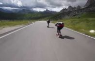 Crazy Downhill Skateboarders Flying By Cyclists